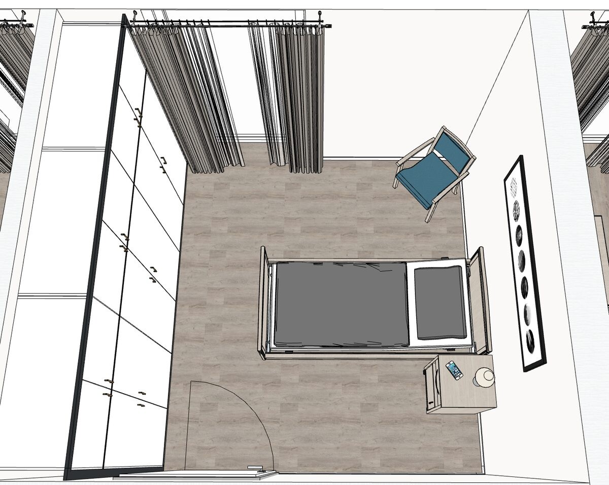 Schlafzimmer mit Pflegebett und Schrank von oben